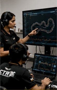 Engineers at telemetry screens showing a circuit map.