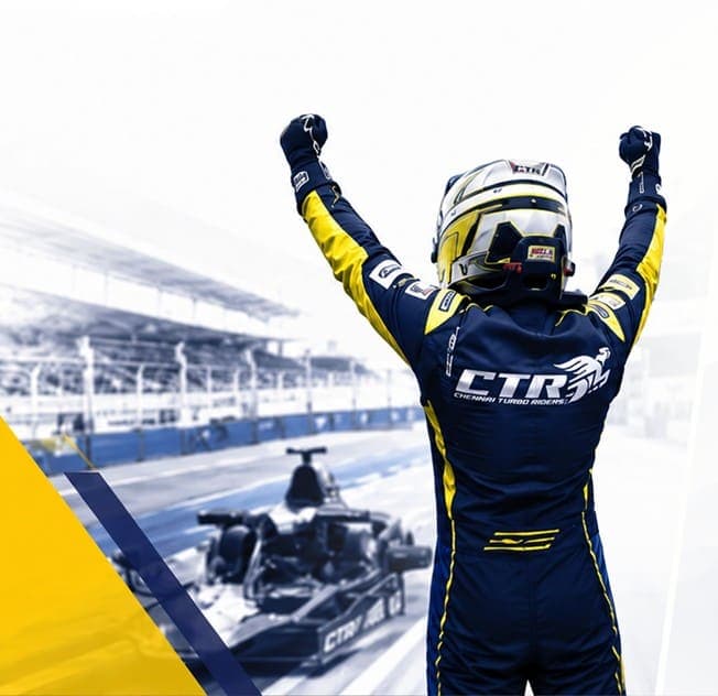 CTR driver in navy-and-gold suit celebrating with arms raised beside a pit-lane image.