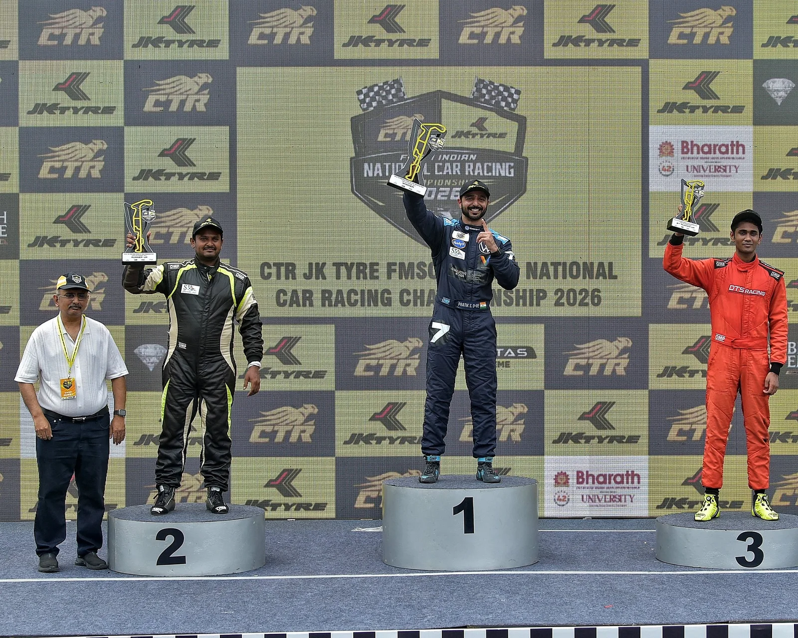 Drivers on the podium with their trophies